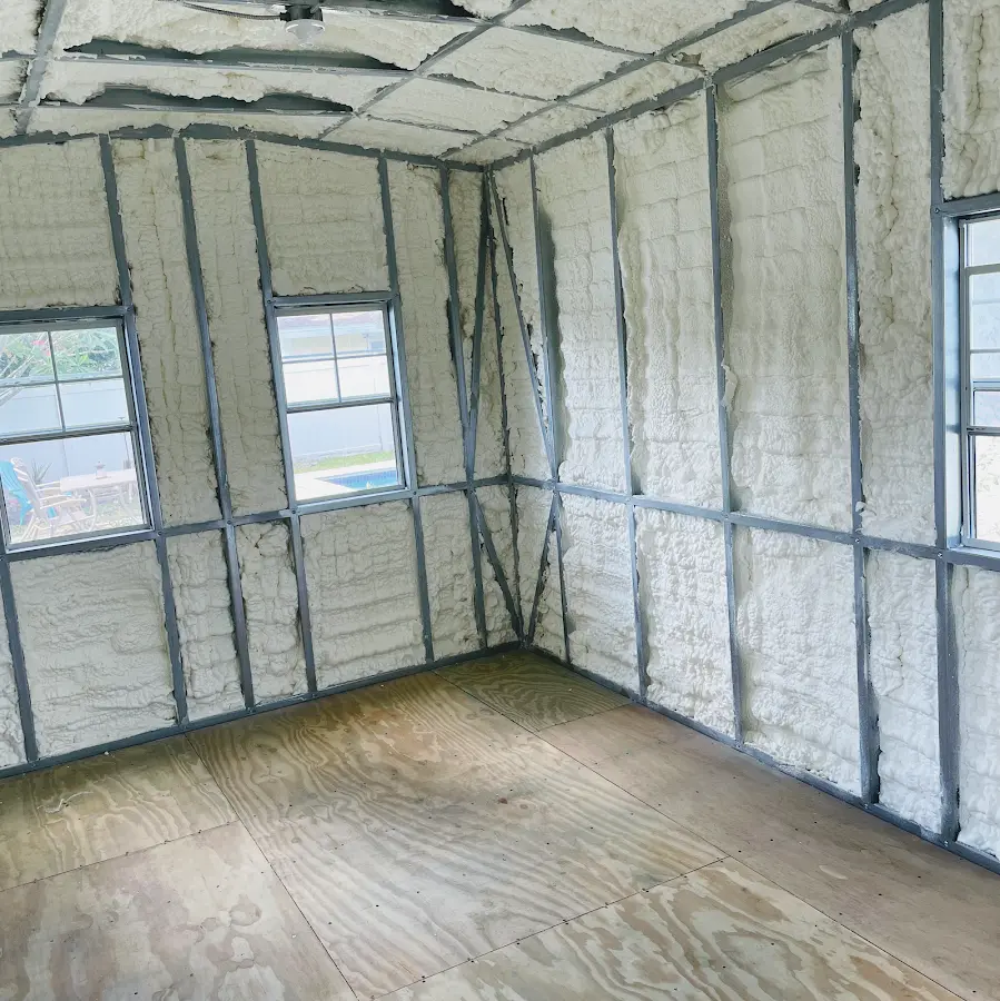 Closed-cell spray foam insulation applied to wall cavities in a residential project in Horizon West